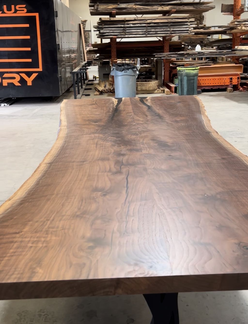 Looking down the length of the walnut top in the shop