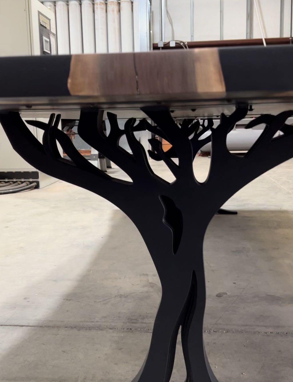 One tree leg straight on, under the end of the walnut top