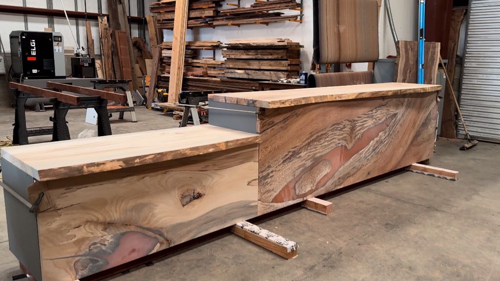 The two-level sycamore bar in our shop before finish, with the lower counter in front and the tall section behind