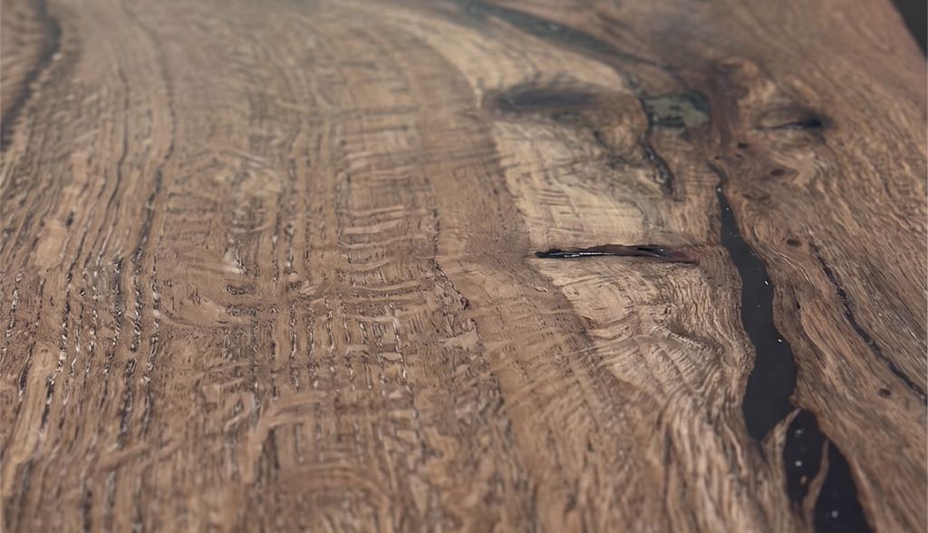 Close-up of silvery ray fleck and a dark filled check in the oak top